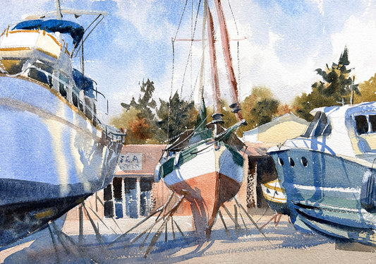 Watercolor painting of boats docked at Port Townsend boat repair yard with trees in the background